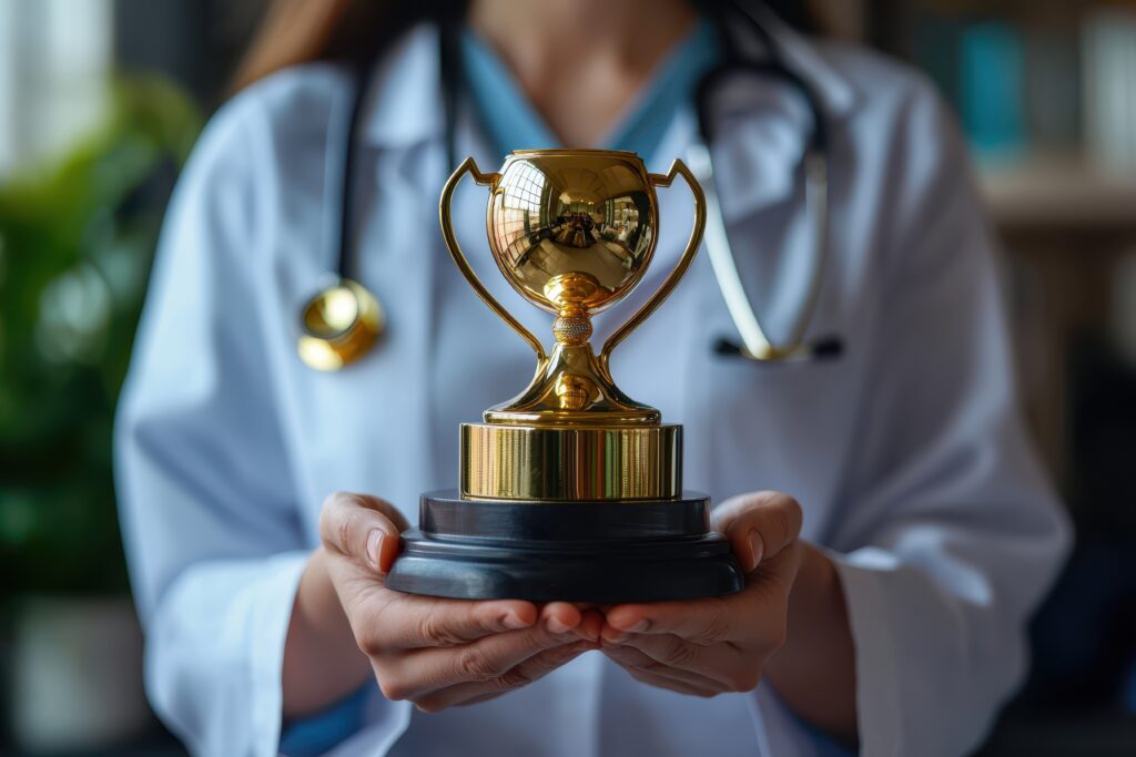 A golden medical trophy awarded to a doctor, representing outstanding achievements and excellence in healthcare, symbolizing dedication, skill, and contributions to the medical field.